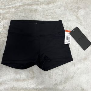 NWT TYR black solid low rise 2” shorts.